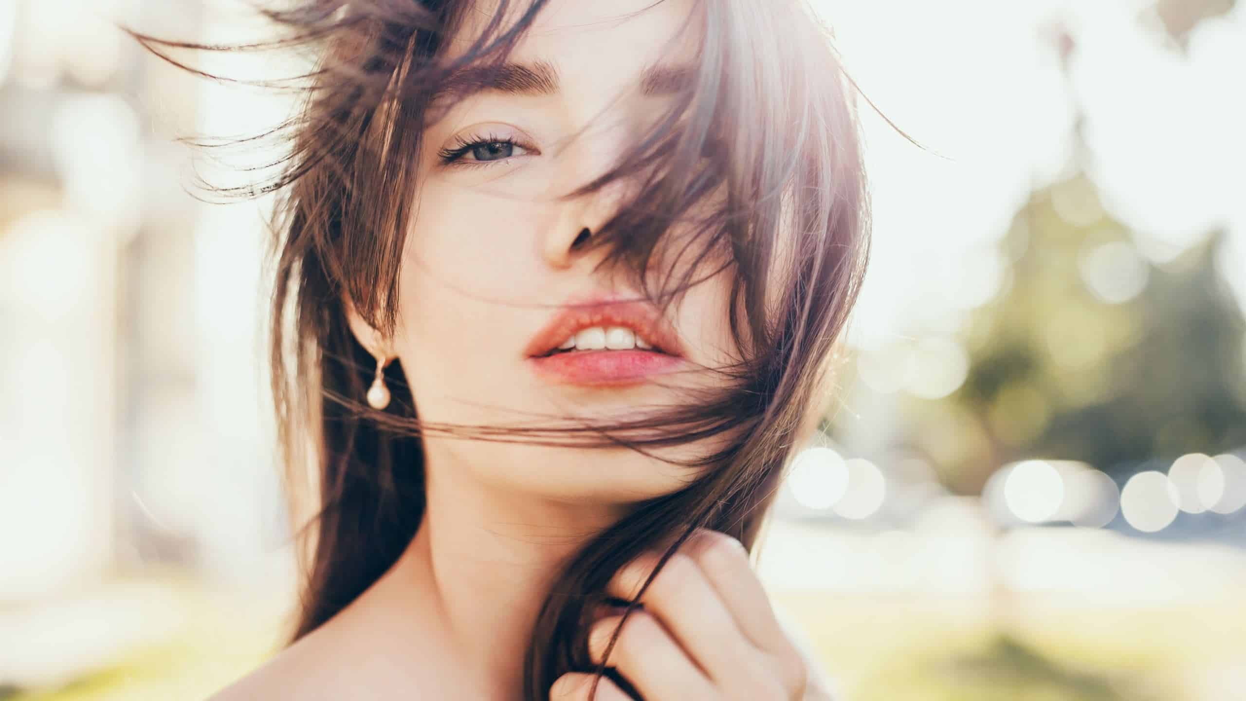 A close-up shot of a girl with brown hair.