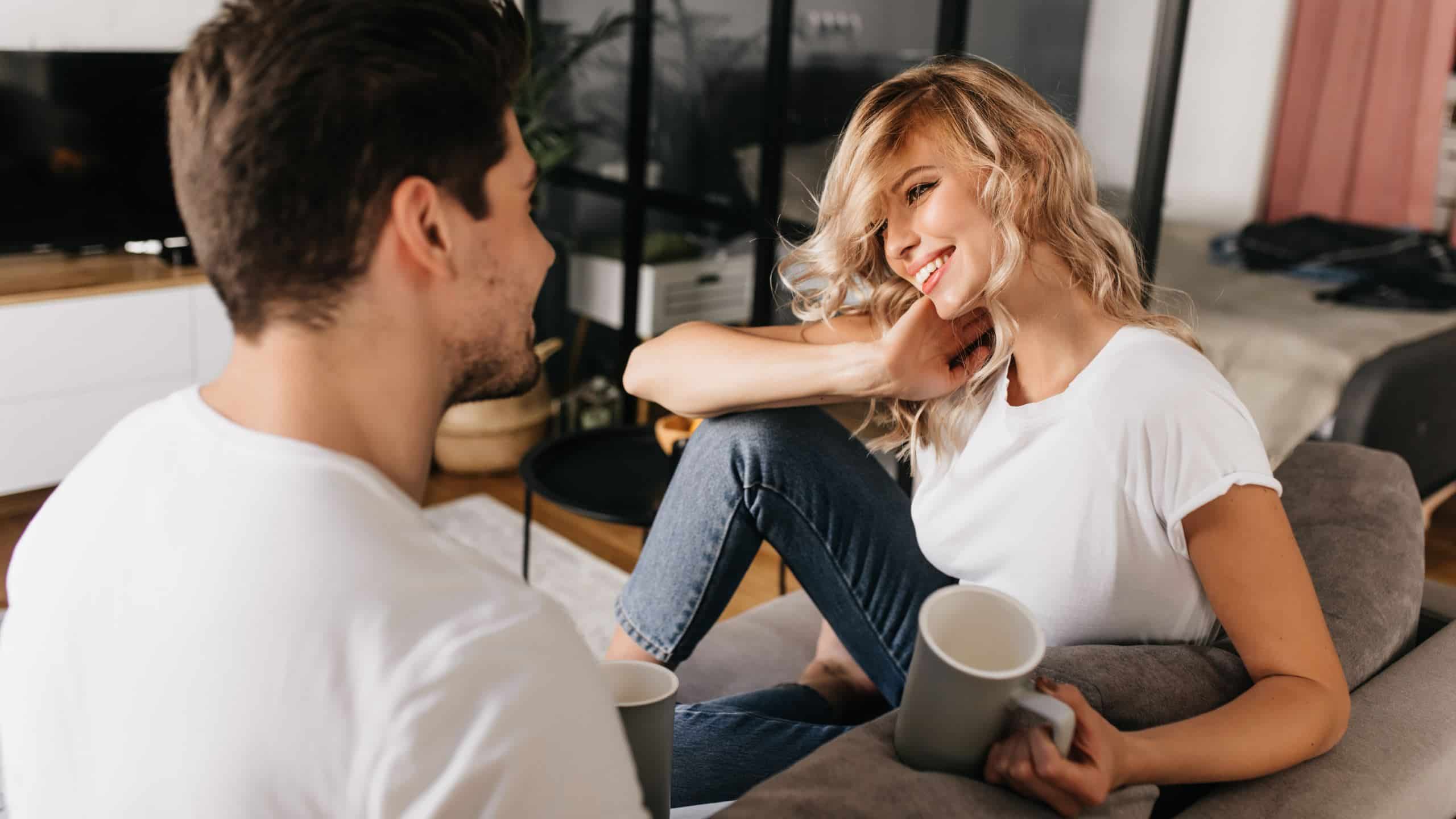 A woman smiling at a man.