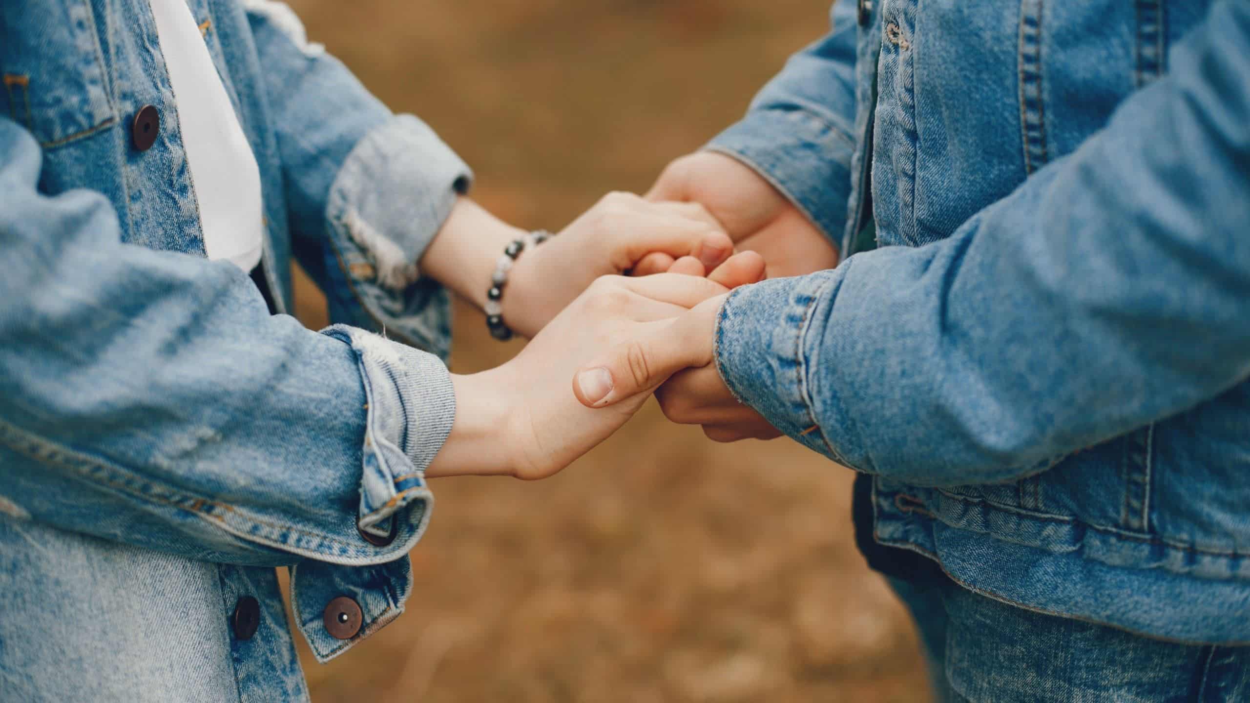 A couple in nature holding hands.